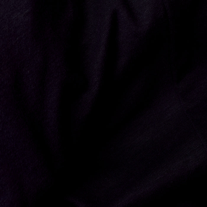 Black V Neck Tee with soft folds and fine weave texture.