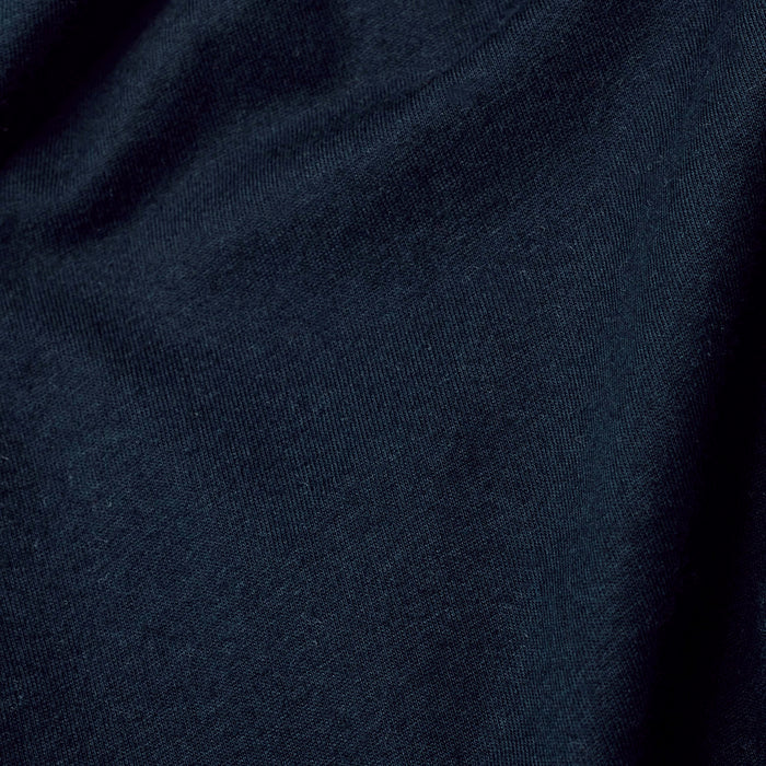 Navy Classic V-Neck with fine knit fabric and gentle folds.