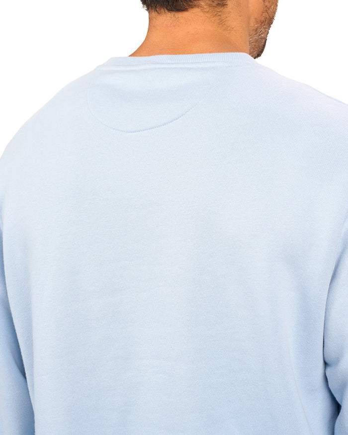 man wearing an light blue colored sweater from Black Clover with a 3d text BLCK CLVR on the chest