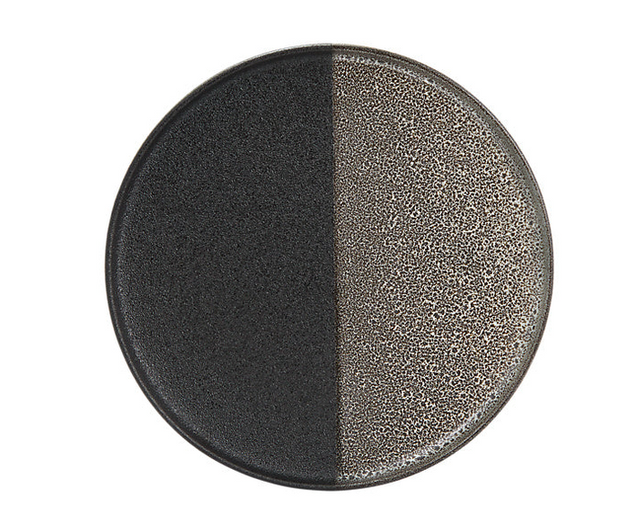 A round porcelain plate with a high rim, featuring a two-tone reactive glaze with a textured surface.