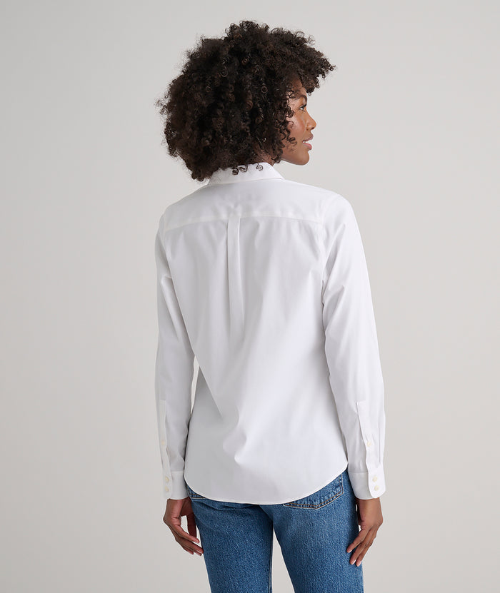 Model is wearing UNTUCKit Bella shirt in white.