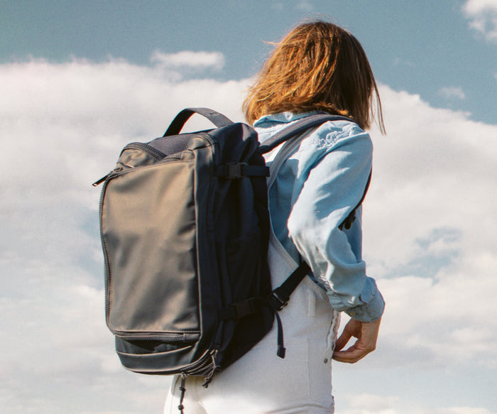 Person wearing the Black 25L backpack outdoors