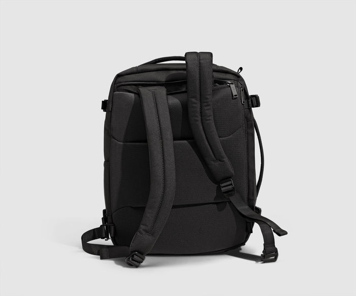Back view showing the removable, padded shoulder straps that can tuck into a back pocket to convert into a duffle
// Removable and adjustable shoulder straps that easily convert into a duffle