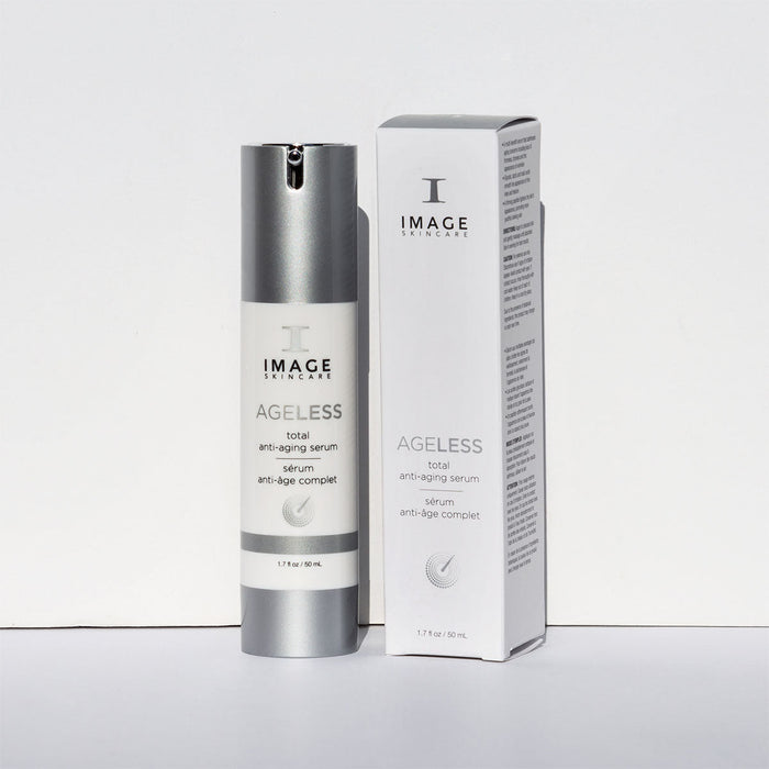 Bottle and box packaging of AGELESS total anti-aging serum | IMAGE Skincare displayed on a plain white background, highlighting the sleek silver and white design for skincare use.