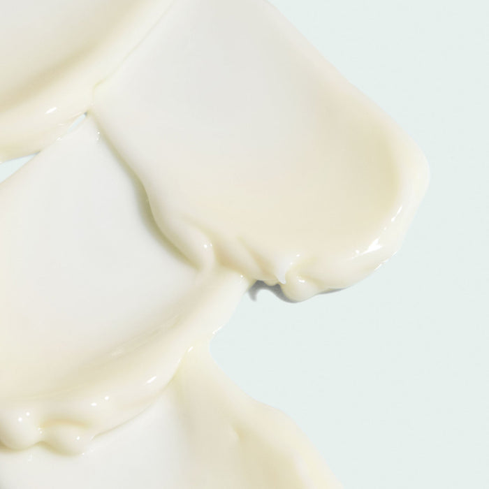 Smooth creamy texture of AGLESS total eye lift crème | IMAGE Skincare shown in close-up, highlighting its rich and nourishing skincare formulation.