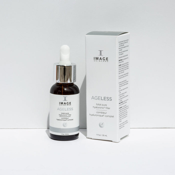 Bottle and box packaging of AGELESS total pure hyaluronic 6 filler | IMAGE Skincare displayed on a white surface for skincare and wellness.