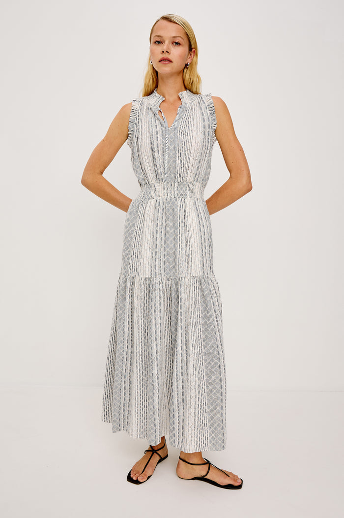 Alessi Maxi Dress in Linen With Smocked Split V-Neckline With Center-Front Ties Diamond Eyelet Detailing All Over Ruffled Trim and Fully Lined Tiered Skirt in Striped Eyelet Colorway - Full Body Front View Featured on Model