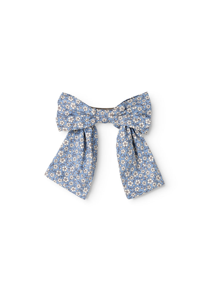 Blue hair clip with bow in small flowers and knot-like ribbon
