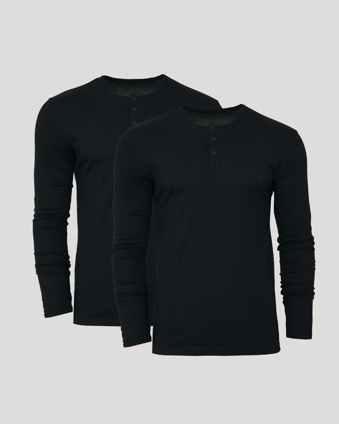 Two black long-sleeve henley shirts on a light gray background