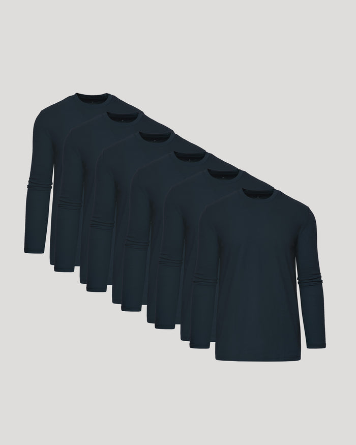 Row of dark blue long-sleeve shirts on a light gray background