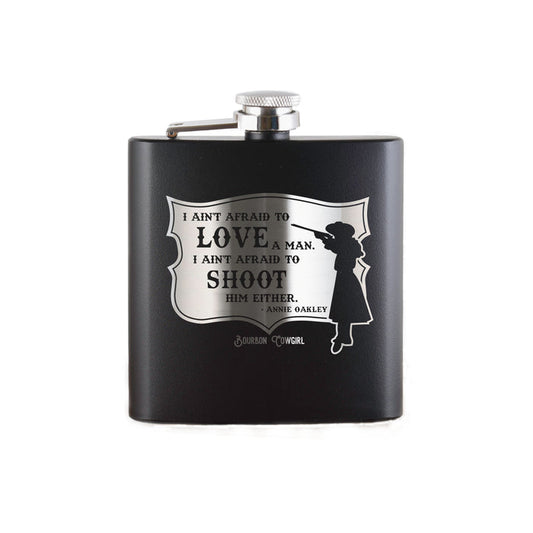 Black flask with Annie Oakley quote