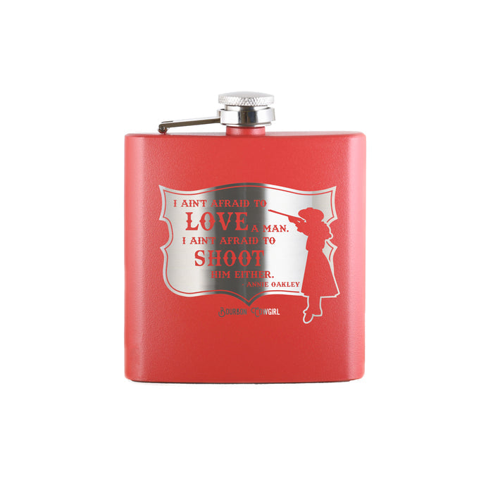 Red flask with Annie Oakley quote