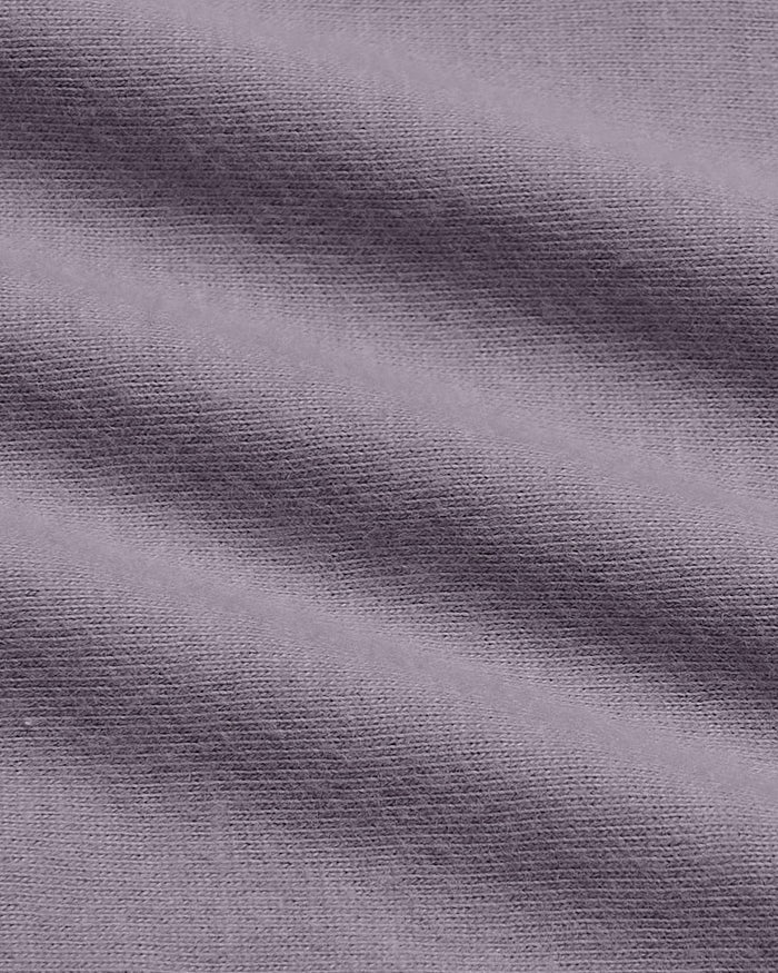 Macro view of Ashberry Classic Long Sleeve Henley's fine knit fabric.