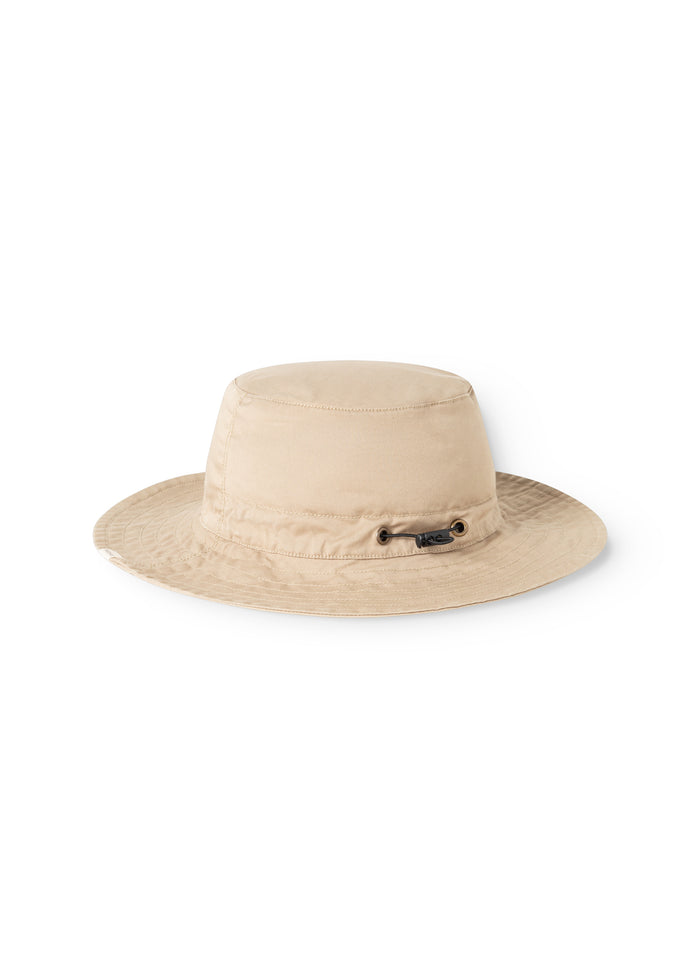 A bright brown cap seen from the front with a button and a wide brim all the way.
