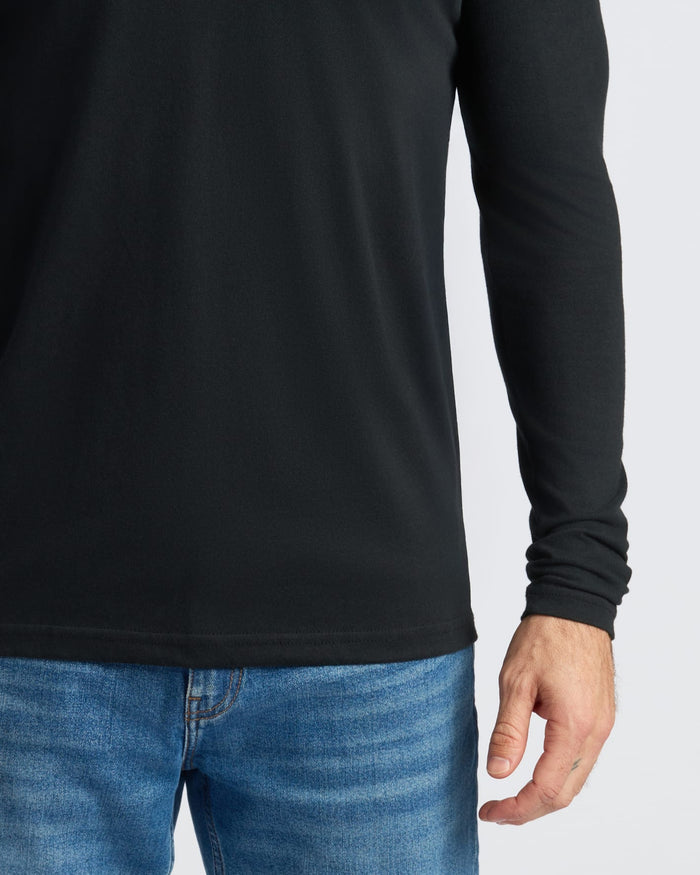 Classic Long Sleeve Crew 3-Pack: black top with medium-wash jeans.