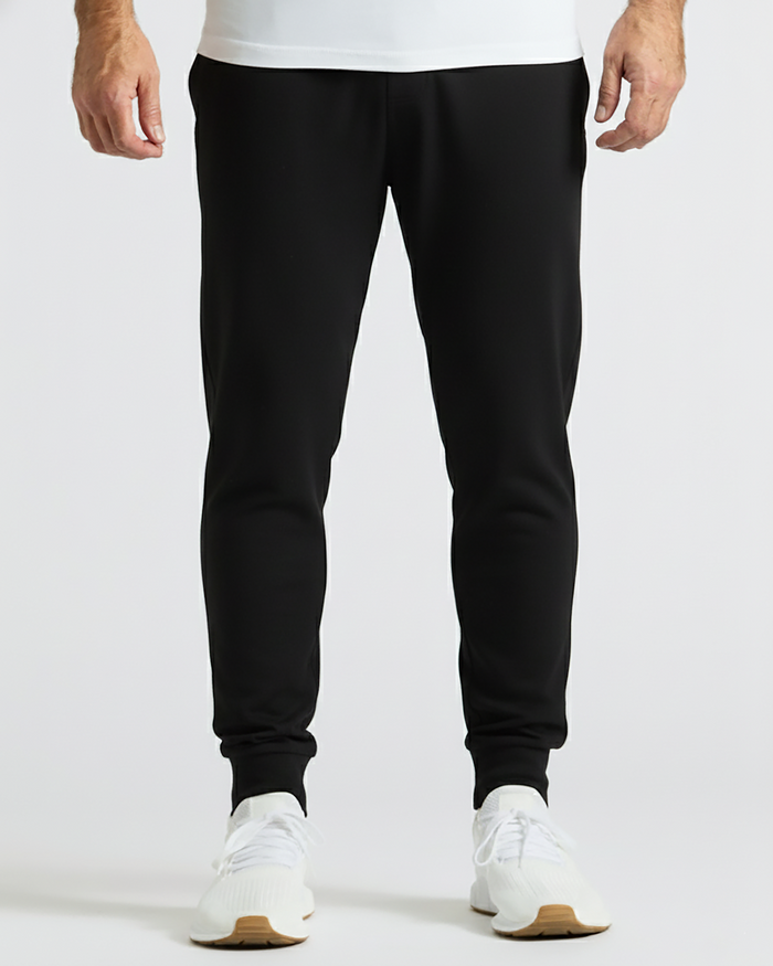 Black Active Joggers worn with white sneakers, showcasing tapered fit.