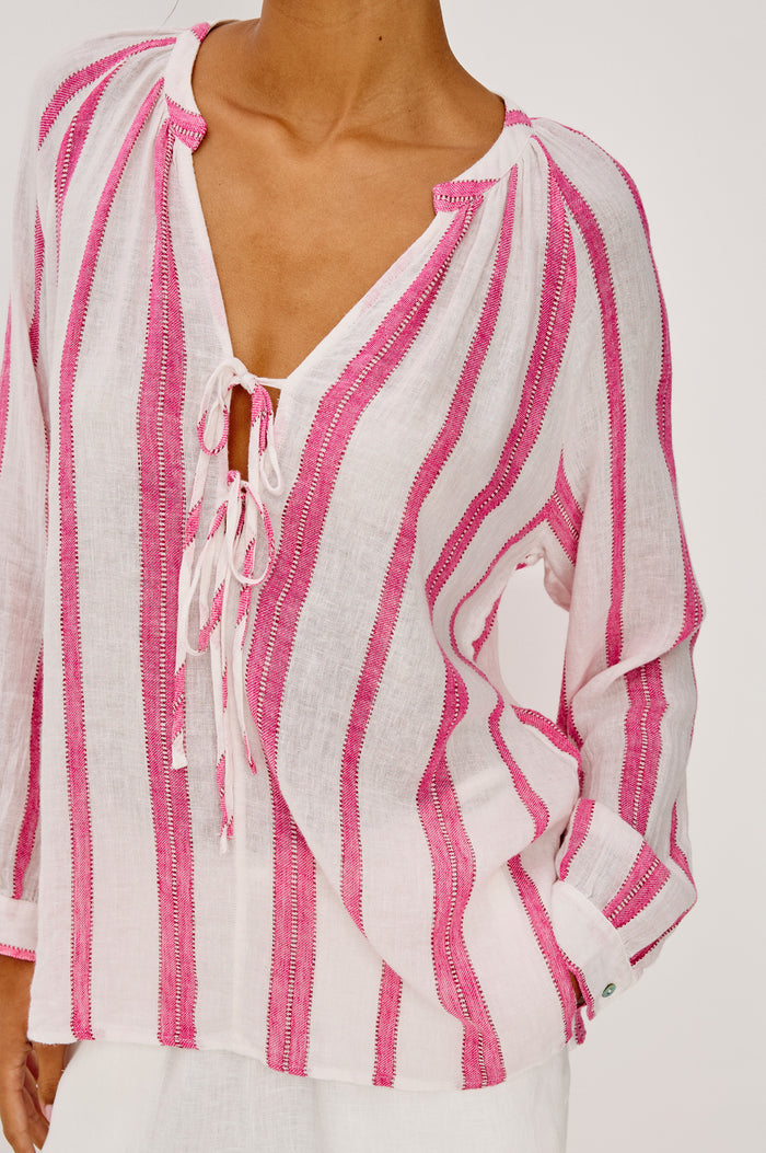 Brielle Blouse in Linen With Mandarin Collar, Loose Fit, Deep V-Neckline With Self-Ties, and Long Sleeves in Delfine Stripe Colorway - Upper Body Front View Featured on Model