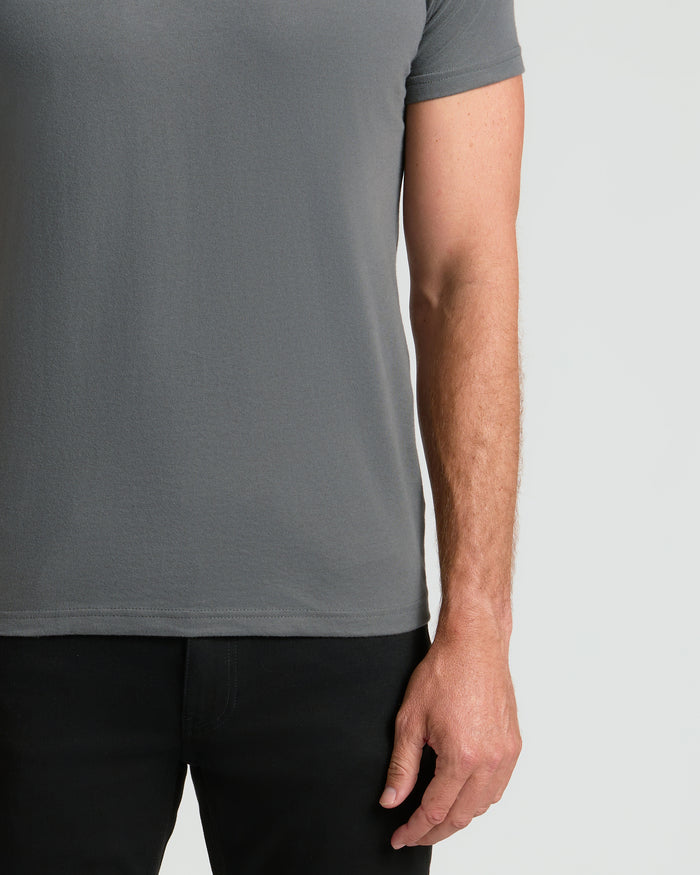 Carbon Classic Crew Neck on person, showcasing fit and relaxed arm.