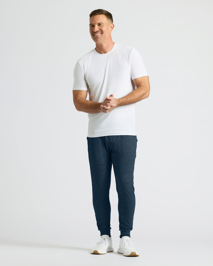 Man in Dark Heather Navy Active Joggers, white t-shirt, and sneakers.