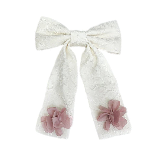 Ivory lace cherry blossom hair bow with soft pink floral details and long ribbon tails for girls