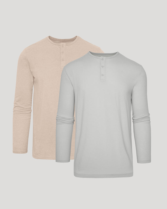 Two long-sleeve shirts, one beige and one gray, on a light gray background.