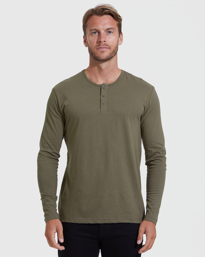 Man wearing Military Green Classic Long Sleeve Henley facing forward.