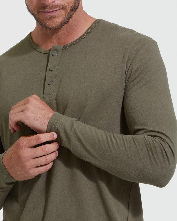 Military Green Classic Long Sleeve Henley worn, cuff adjusted by a person.