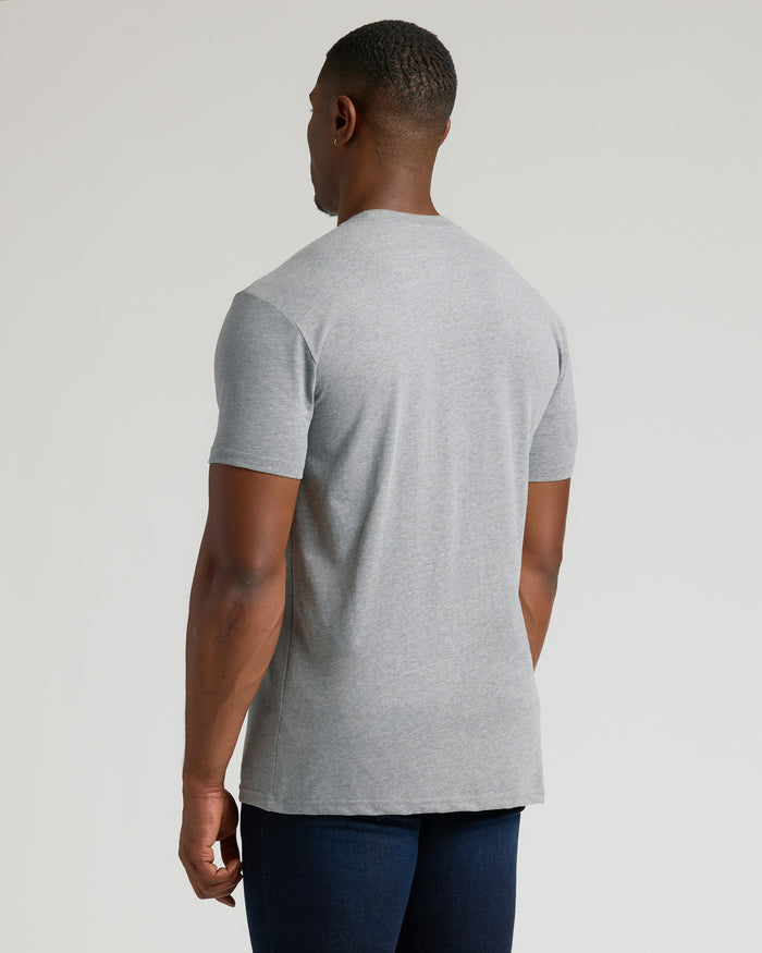 Man wearing Classic Tall Straight Hem Crew Neck T-Shirt over dark jeans.