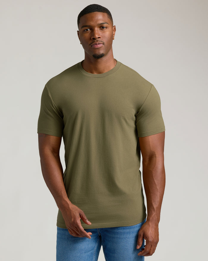 Man wearing Classic Tall Straight Hem Crew Neck T-Shirt in olive-green with jeans.