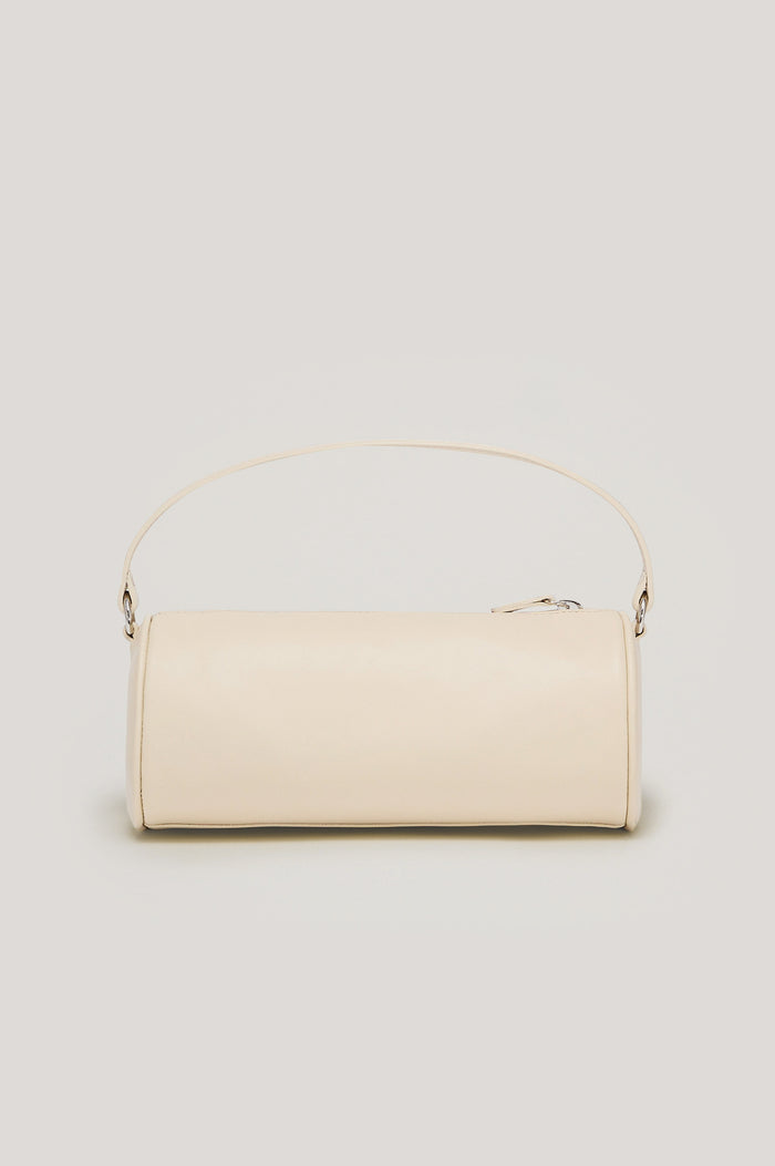 Como Mini Barrel Bag in Italian Leather With Fixed Top Strap, Removable and Adjustable Buckled Crossbody Strap, Top Zipper, Side-Embossed Logo, Branded Interior Label in Bone Colorway - Front View Featured