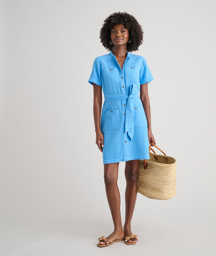 Model is wearing UNTUCKit avry dress in solid blue.
