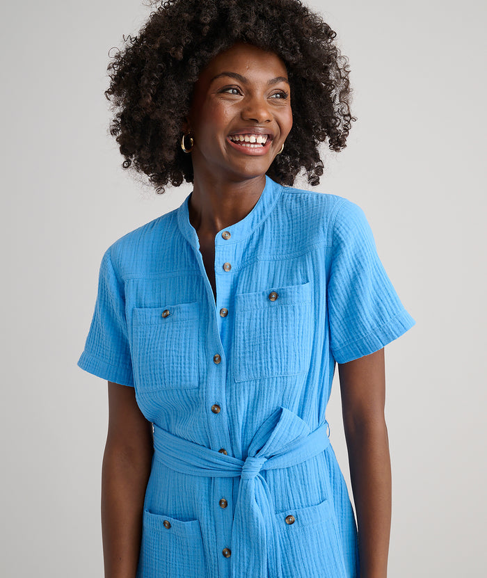 Model is wearing UNTUCKit avry dress in solid blue.