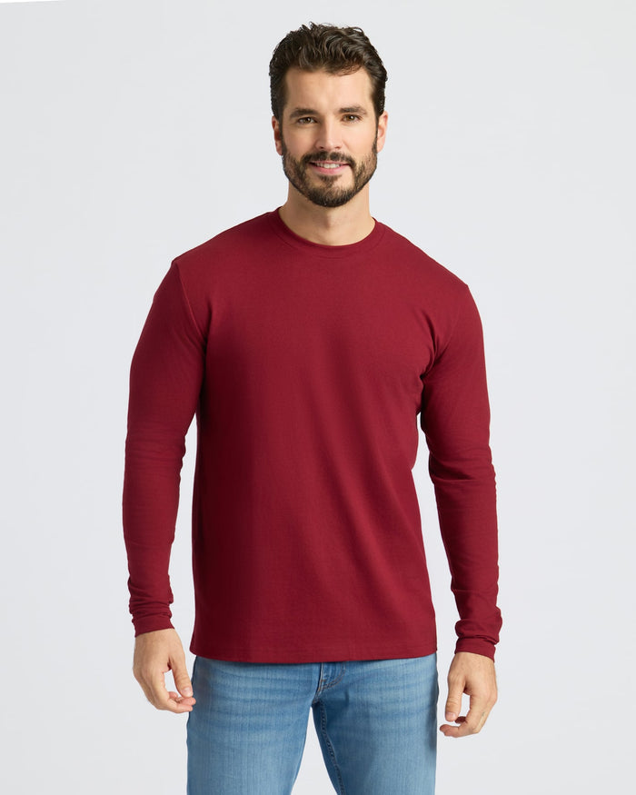 Man wearing Dark Maroon Classic Long Sleeve Crew Neck and jeans.