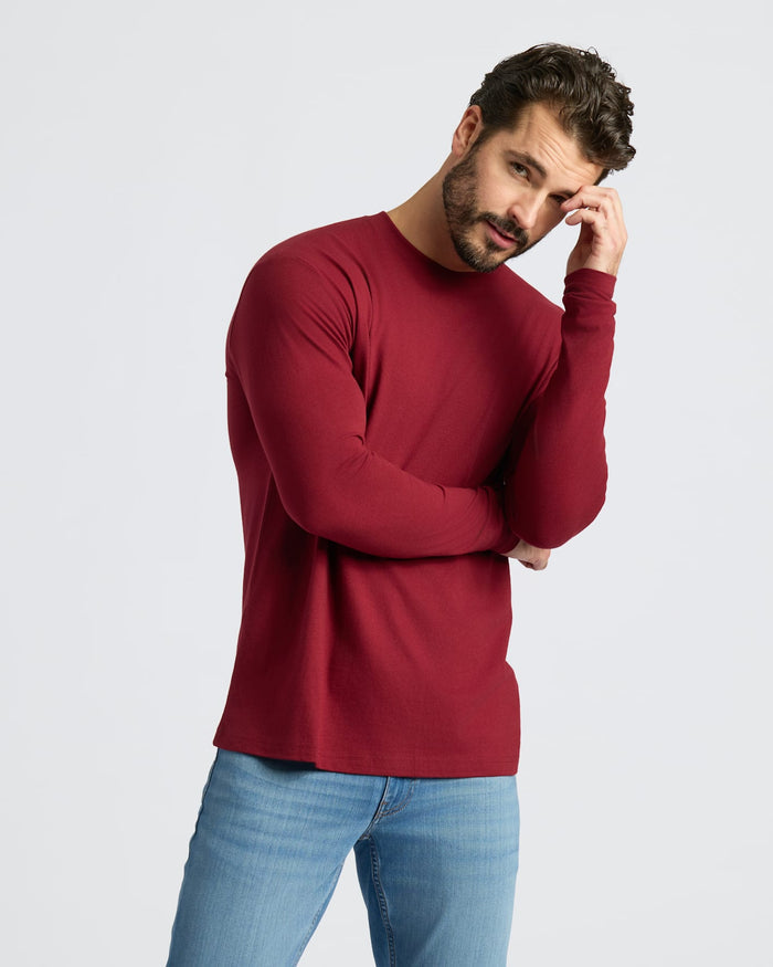 Man in Classic Long Sleeve Crew Neck 6-Pack, red shirt, blue jeans.