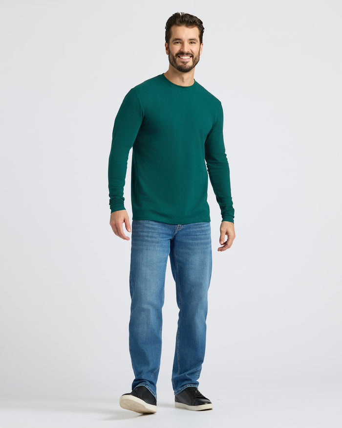 Man wearing Deep Emerald Classic Long Sleeve Crew Neck with jeans.