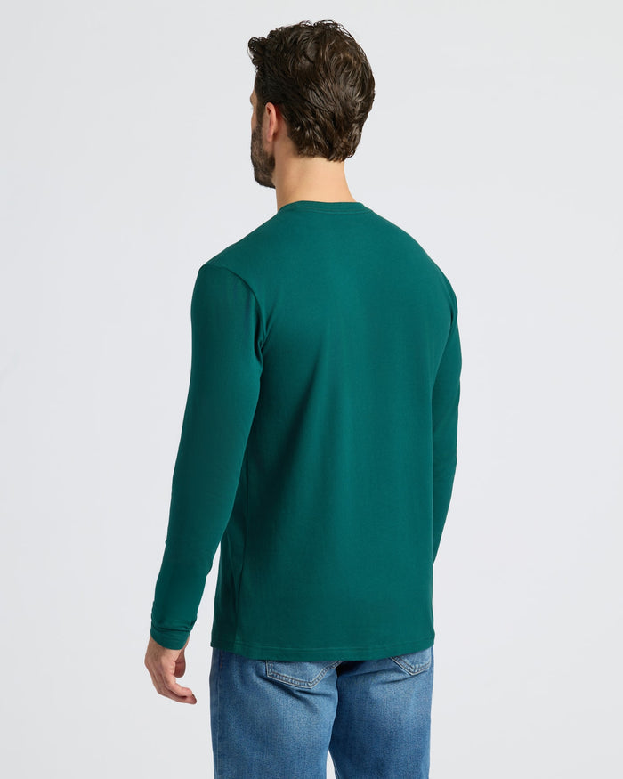 Man wearing Classic Long Sleeve Crew Neck in teal.