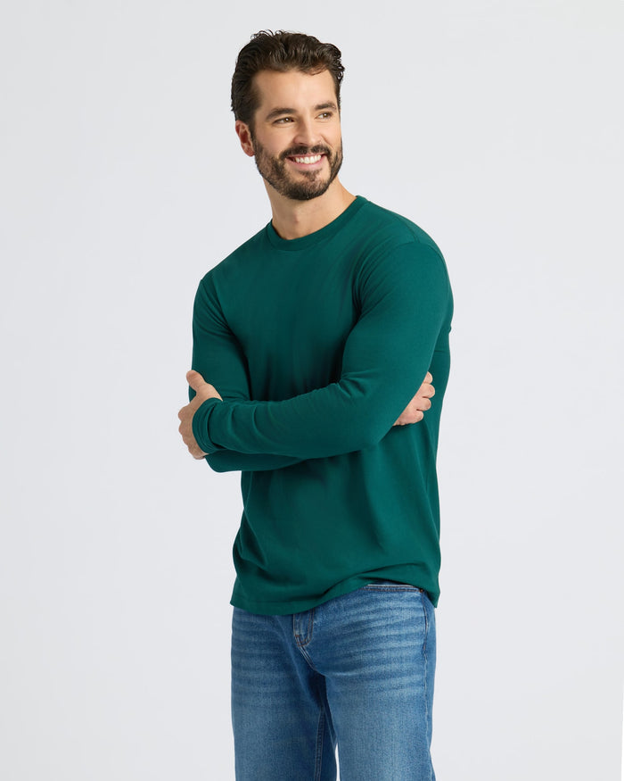 Man in Classic Long Sleeve Crew Neck 6-Pack, wearing forest-green shirt and jeans.