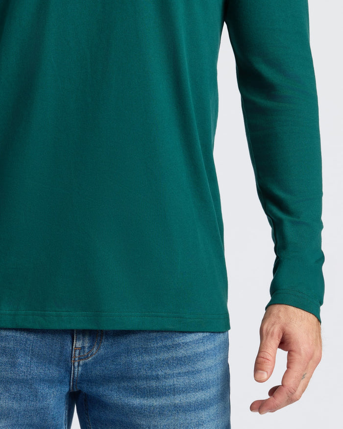 Deep Emerald Classic Long Sleeve Crew Neck with blue jeans, right arm visible.