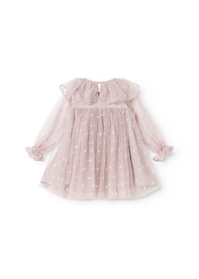Dear B in a light pink with small hearts, wrinkled top and puffer sleeves.