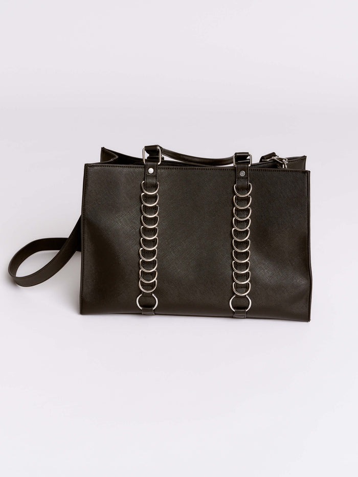 Black handbag with chain details on a light gray background