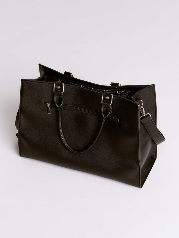 Black leather handbag on a light gray background