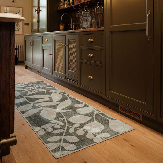Eden Leaves Green Eco-Washable Runner- 100% recycled content runner featuring a white floral pattern against a green background.