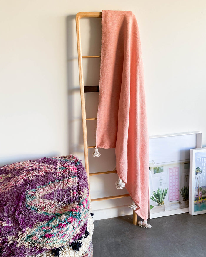 handmade woven coral pink Moroccan pom pom blanket
