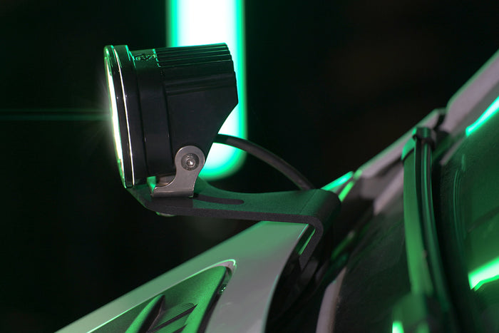 HOODLINE LIGHT POD MOUNT - SPRINTER (2019+) by VAN COMPASS: Close-up of a van's hood, showcasing easily installed LED pod mounts attached to the factory hood hinge studs.
