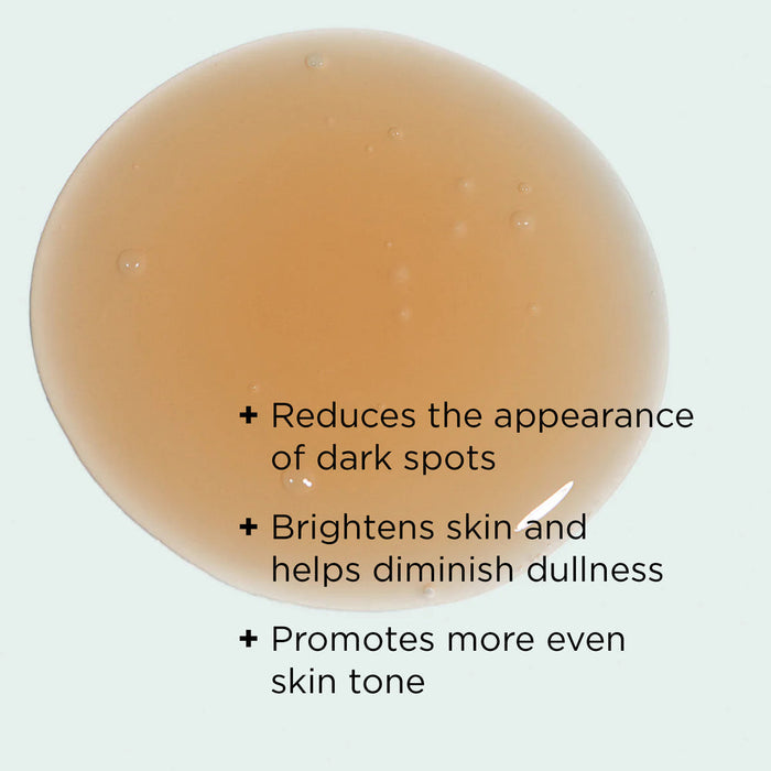 Close-up of a serum drop showing benefits of ILUMA® intense brightening serum | IMAGE Skincare including reducing dark spots, brightening skin, and promoting even skin tone for skincare.