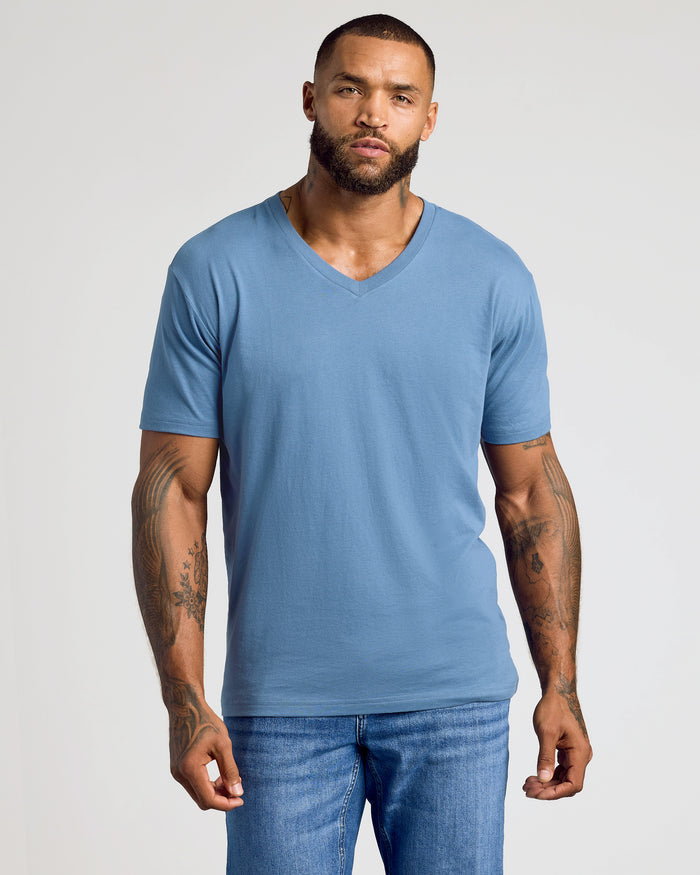 Indigo Classic V-Neck worn by man with tattoos.