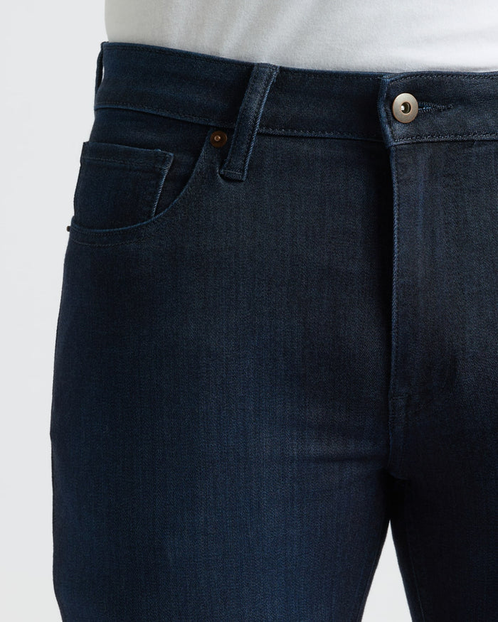 Indigo Wash Slim Comfort Stretch Jeans with tucked white shirt.