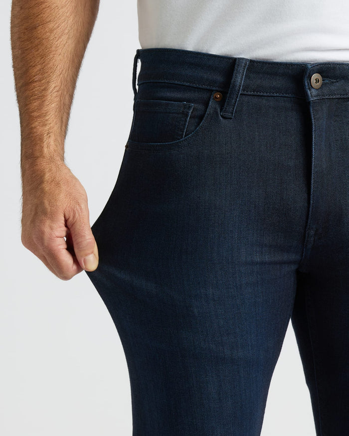Indigo Wash Slim Comfort Stretch Jeans showcasing stretchability at the thigh.