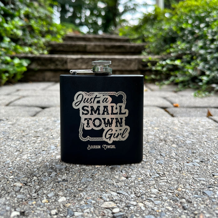 Black flask with Just a Small Town Girl text.