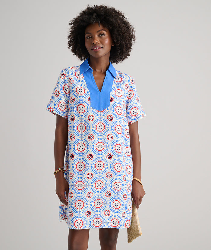 Model are wearing UNTUCKit Paola dress in printed tile blue.